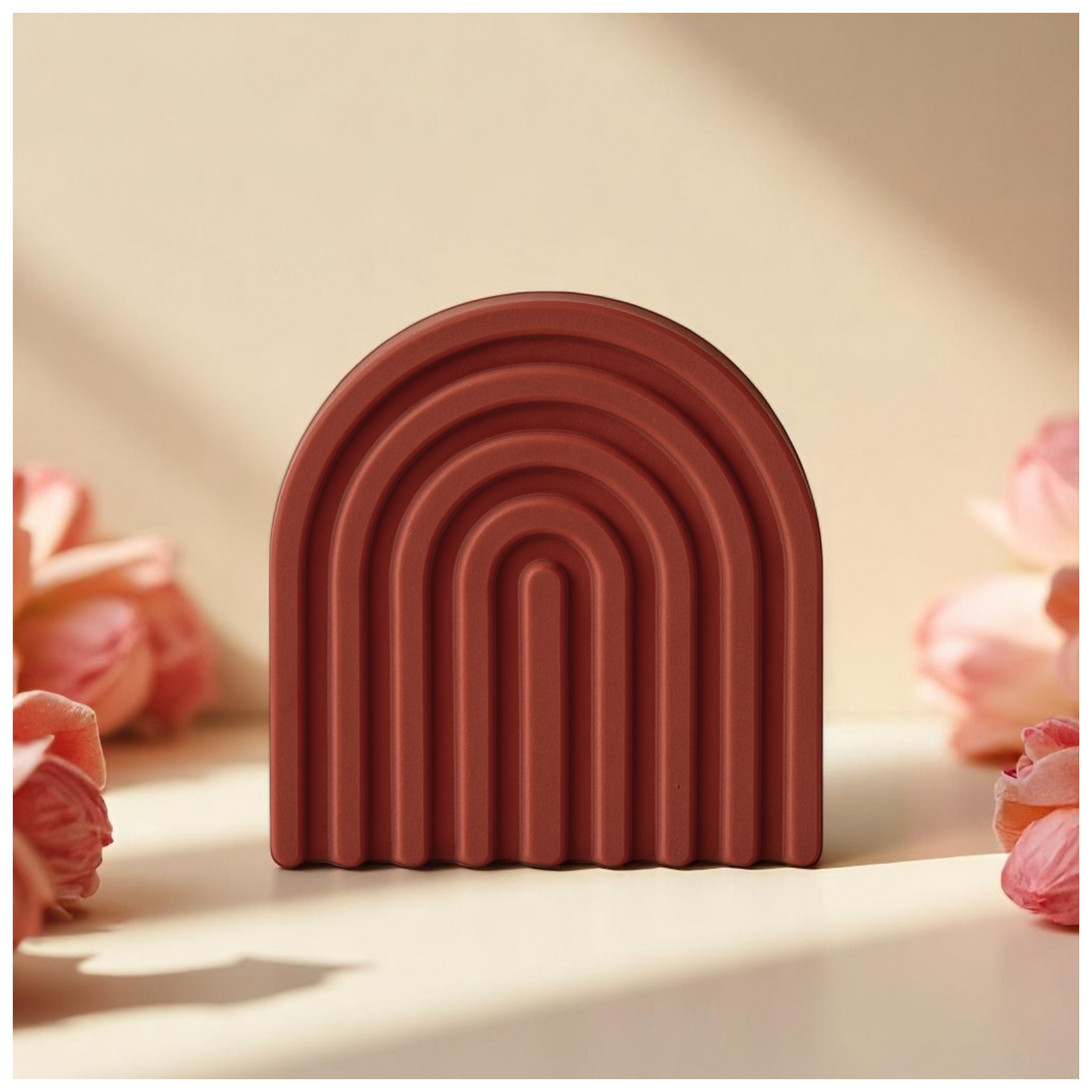 LIVIA - an arch-shaped decor from SIMT:artelier, handcrafted earthy red Jesmonite sculptural form for soulful, intentional spaces