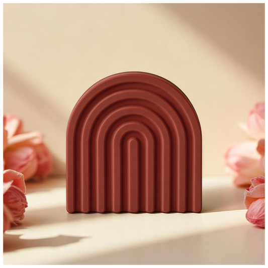 LIVIA - an arch-shaped decor from SIMT:artelier, handcrafted earthy red Jesmonite sculptural form for soulful, intentional spaces